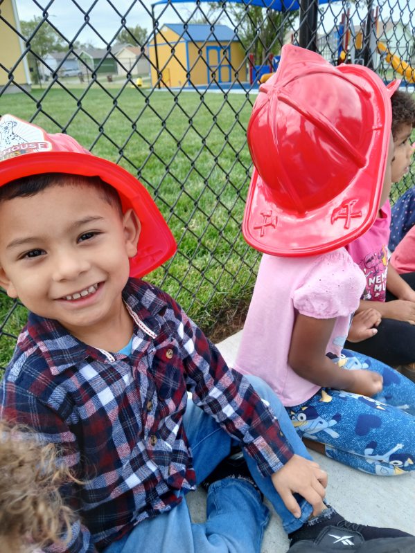 Children engaged in hands-on learning at Kids' World